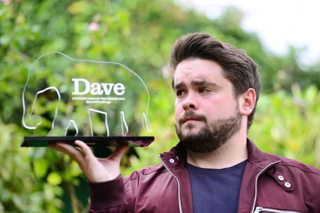Adam Rowe with his award.
