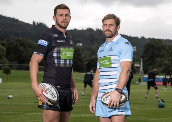 Co-captains Callum Gibbins and Ryan Wilson show off Glasgow Warriors' new strips. Picture: SNS Group