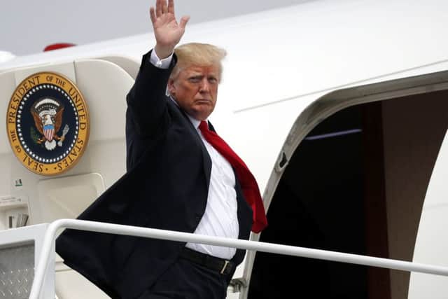 Donald Trump boards Air Force One for a trip to his private 
golf resort at Bedminster in New Jersey. Picture: AP