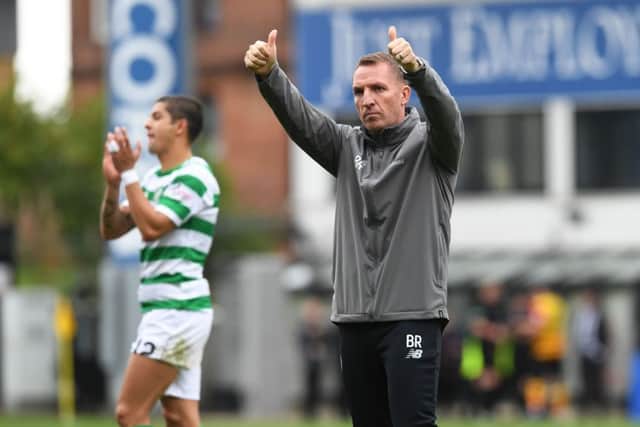 Celtic manager Brendan Rodgers applauds the fans at full-time. Pic: SNS/Craig Foy