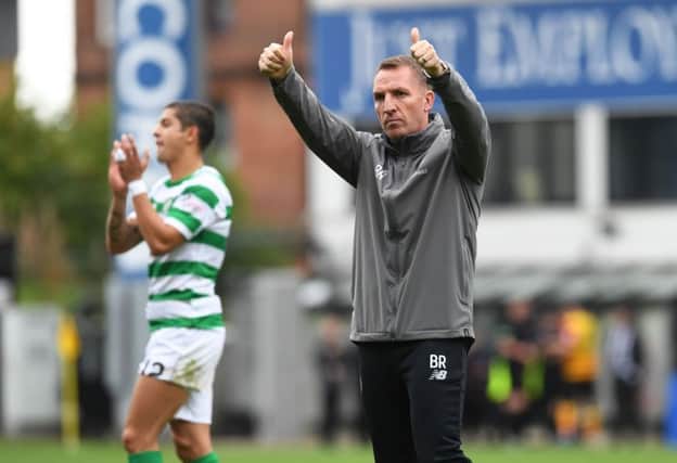 Celtic manager Brendan Rodgers applauds the fans at full-time. Pic: SNS/Craig Foy
