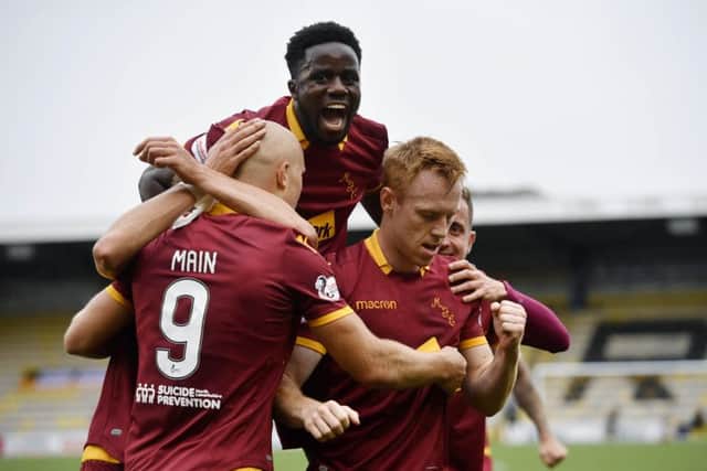 Motherwell's Danny Johnston celebrates his goal. Pic: SNS/Rob Casey