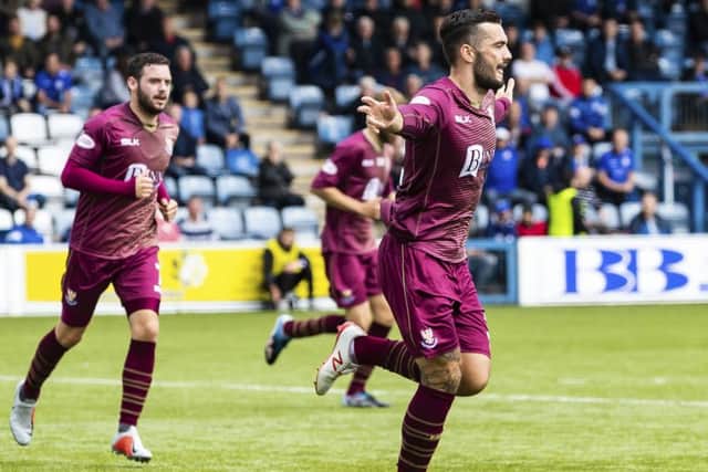 St Johnstone's Tony Watt celebrates scoring his first goal. Pic: SNS/Roddy Scott