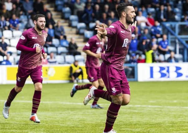 St Johnstone's Tony Watt celebrates scoring his first goal. Pic: SNS/Roddy Scott