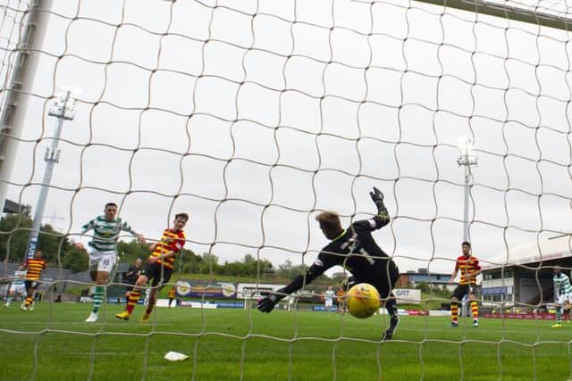 Tom Rogic, left, scores Celtics third goal in their Betfred Cup victory over Partick Thistle on Saturday. Picture: SNS.