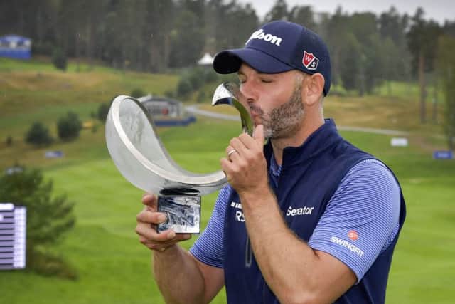 Paul Waring of England kisses the trophy after winning the Nordea Masters at Hills Golf Club. Picture: AP
