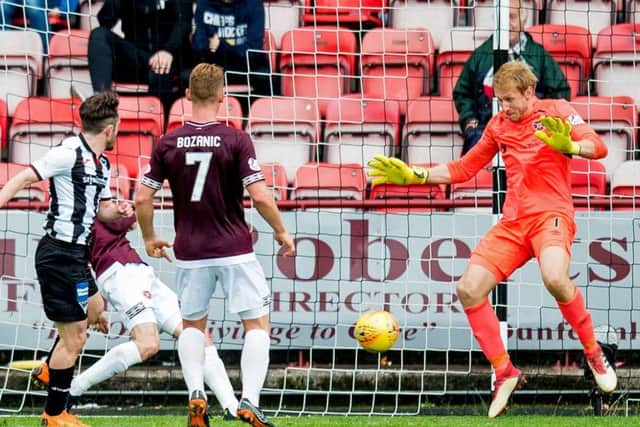 Hearts goalkeeper Zdenek Zlamals instinctive save from Aidan Connollys last-gasp effort denied Dunfermline an equaliser. Picture: SNS.