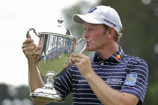 Brandt Snedeker kisses the trophy after winning the Wyndham Championship. Picture: Chuck Burton/AP