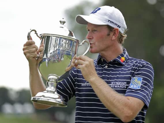 Brandt Snedeker kisses the trophy after winning the Wyndham Championship. Picture: Chuck Burton/AP