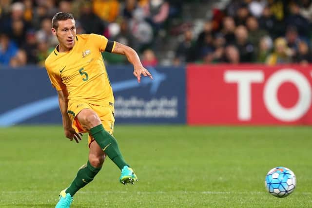 Graham Arnold is hopeful Mark Milligan will U-turn on his decision to hang up his international boots. Picture: Getty Images