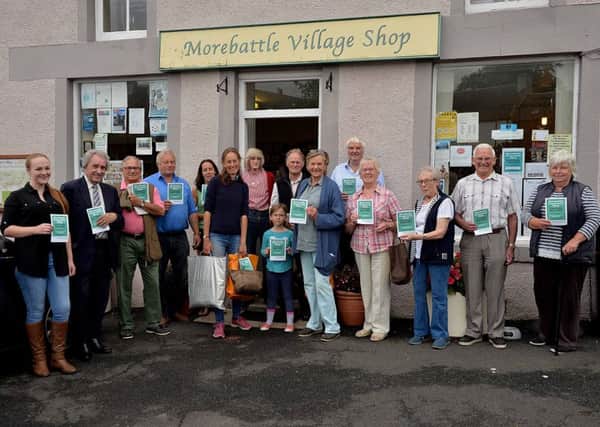 Members of the Morebatle Village Shop steering roup outside the store.