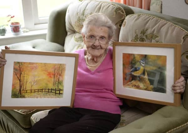 Pensioner Margaret McNeil, draws pastels and paintings from memory despite being registered blind.  Picture: SWNS