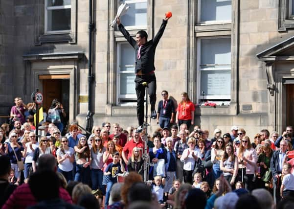 An Edinburgh Festival Fringe entertainer performs on the Royal Mile Picture: Jeff J Mitchell/Getty Images
