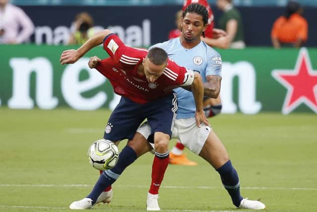 Douglas Luiz grapples with Bayern Munich's Franck Ribery during the International Champions Cup match between Bayern Munich and Manchester City. Picture: AFP/Getty Images
