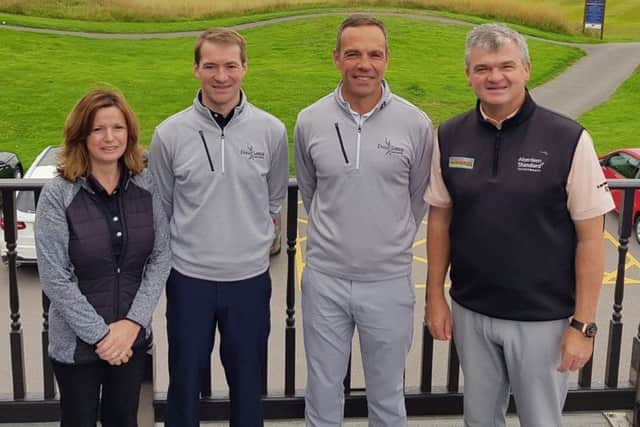 Spencer Henderson with Paul Lawrie at the Paul Lawrie Golf Centre in Aberdeen.