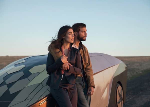 Grey Trace (Logan Marshall-Green) and his wife Asha (Melanie Vallejo) in Upgrade