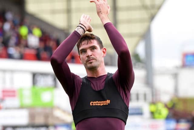 Kyle Lafferty applauds the travelling Hearts fans after the Betfred Cup win over Dunfermline on Saturday. Picture: Ross Parker/SNS
