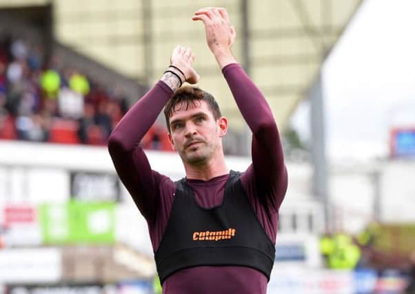 Kyle Lafferty applauds the travelling Hearts fans after the Betfred Cup win over Dunfermline on Saturday. Picture: Ross Parker/SNS