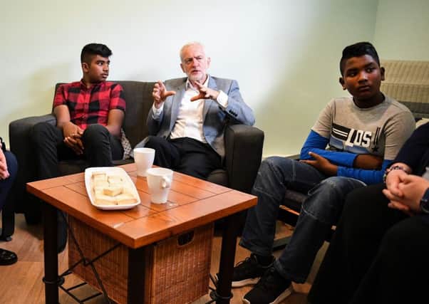 Labour leader Jeremy Corbyn meets with asylum seeker brothers Somer Umeed and Areeb Umeed, who were among those threatened with eviction by Serco. Picture: Jeff J Mitchell/Getty Images