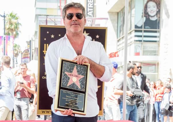 Simon Cowell attends a ceremony honoring him with a star on the Hollywood Walk of Fame. Picture: Getty Images