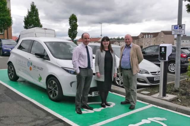 Business Development Manager Nick Clark, Board Chair Susan McDonald and CEO Andrew Saunders with the new Renault Zoe electric car and charging points at the Ore Valley Business Centre.