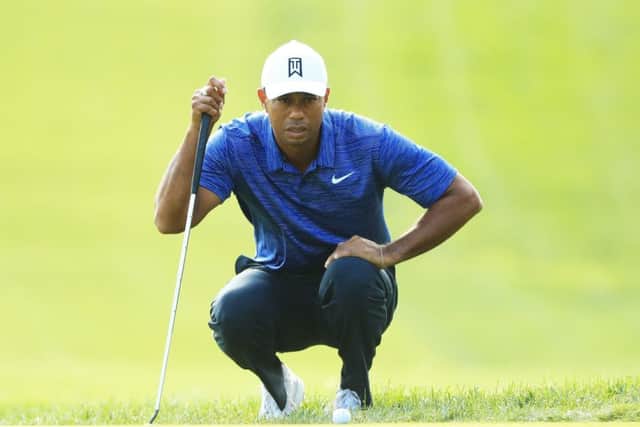 Tiger Woods lines up a putt on the ninth green during the first round of The Northern Trust. Picture: Andrew Redington/Getty