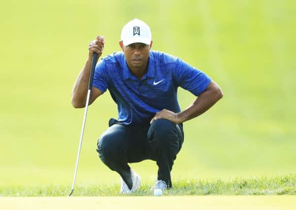 Tiger Woods lines up a putt on the ninth green during the first round of The Northern Trust. Picture: Andrew Redington/Getty