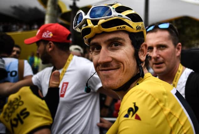 Tour de France winner Great Britain's Geraint Thomas wearing the overall leader's yellow jersey smiles after the 21st and last stage of the 105th edition of the Tour de France cycling race between Houilles and Paris Champs-Elysees. Picture: MARCO BERTORELLO/AFP/Getty Images.