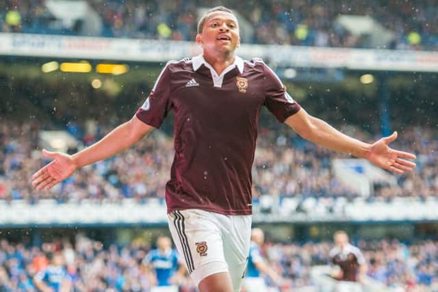 Osman Sow celebrates after scoring the winning goal at Ibrox in his Hearts league debut. Picture: Ian Georgeson