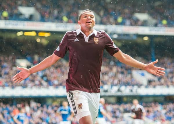 Osman Sow celebrates after scoring the winning goal at Ibrox in his Hearts league debut. Picture: Ian Georgeson