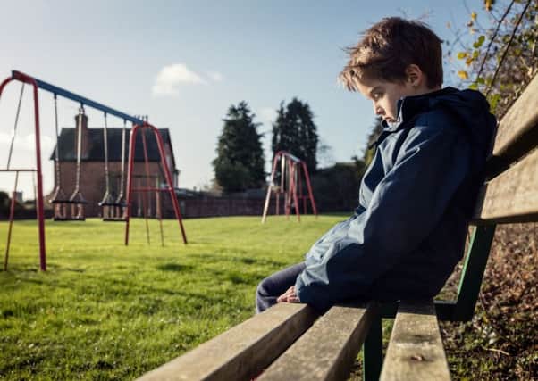 Generic photo of an upset problem child sitting on play park playground bench concept for bullying, depression, child protection or loneliness. See PA Feature FAMILY Lonely. Picture credit should read: PA Photo/thinkstockphotos.
