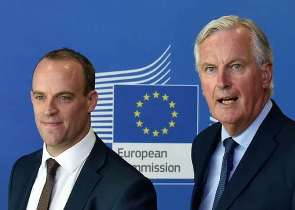 UK Brexit minister Dominic Raab, left, and the EU chief Brexit negotiator Michel Barnier. Picture: Getty
