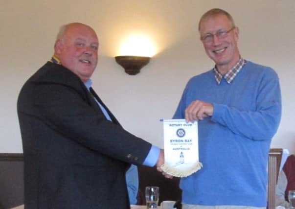 Ronnie Falconer (right) presenting the Byron Bay Rotary pennant to Jim Findlay, President of Rothesay Rotary,