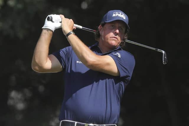 Phil Mickelson hits an iron off the second tee during his second round in the Northern Trust. Picture: The Record via AP.