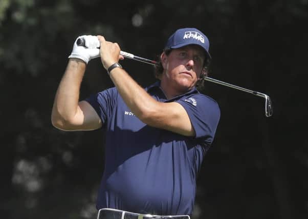 Phil Mickelson hits an iron off the second tee during his second round in the Northern Trust. Picture: The Record via AP.