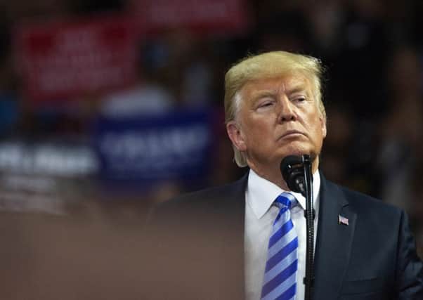 President Donald Trump takes the stage at a rally in support of the Senate candidacy of West Virginia's Attorney General Patrick Morrisey, last week. Picture: Craig Hudson/Charleston Gazette-Mail via AP