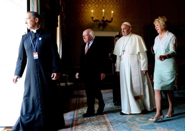 Pope Francis walking with Ireland's President Michael Higgins and wife Sabina Coyne at the Aras an Uachtarain Presidential Residence. Picture: Getty