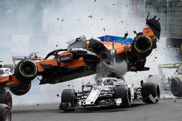 Fernando Alonsos Mercedes crashes on to the top of Charles Leclercs Sauber after being struck by the Renault of Nico Hulkenberg. Picture: AFP/Getty.