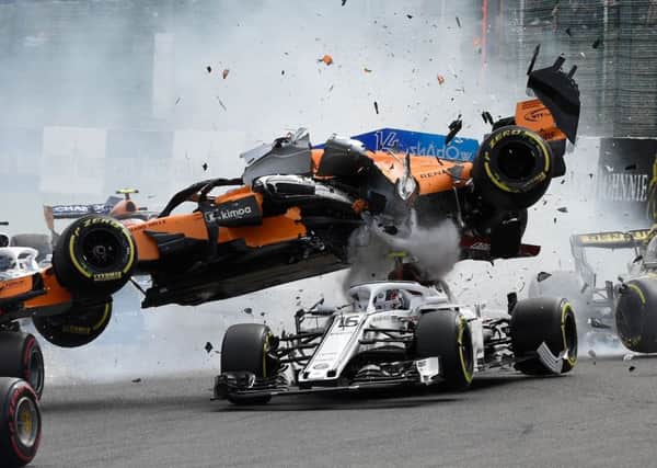 Fernando Alonsos Mercedes crashes on to the top of Charles Leclercs Sauber after being struck by the Renault of Nico Hulkenberg. Picture: AFP/Getty.