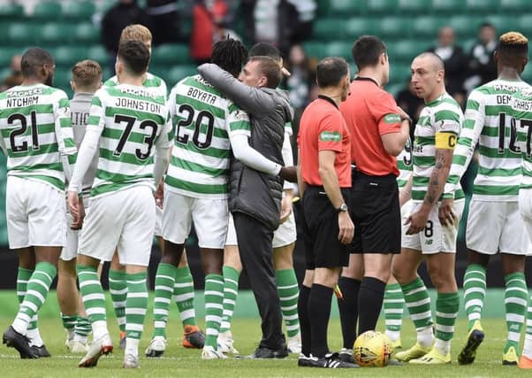 Celtic manager Brendan Rodgers gives goalscorer Celticâ¬"s Dedryck Boyata a hug after the Ladbrokes Scottish Premiership match at Celtic Park, Glasgow. PRESS ASSOCIATION Photo. Picture date: Sunday August 26, 2018. See PA story SOCCER Celtic. Photo credit should read: Ian Rutherford/PA Wire. EDITORIAL USE ONLY