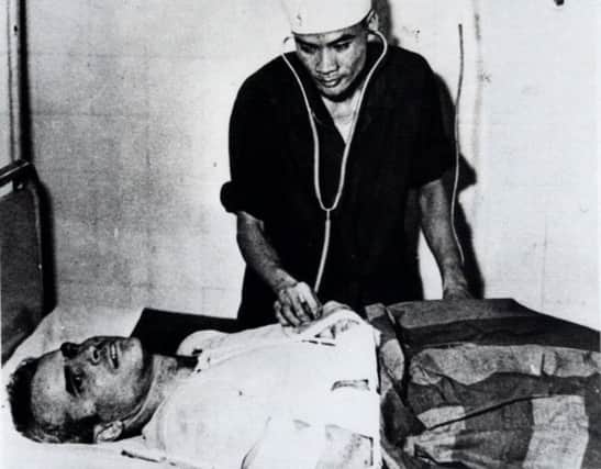 John McCain, seen in 1967 as a prisoner of war in Vietnam, was Ã¿injured after being shot down (Picture: AP)