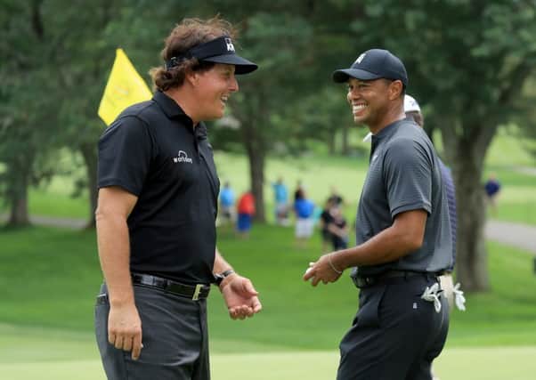 The big-money match between Phil Mickelson, left, and Tiger Woods is more likely to damage golf than enhance it. Picture: Getty.