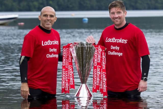 Former Rangers midfielder Alex Rae, left, and ex-Celtic full-back Mark Wilson preview Sundays fixture in the water at Loch Lomond. Picture: SNS.