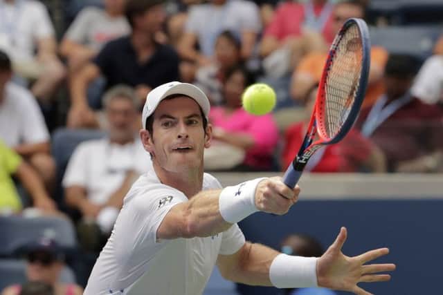 Andy Murray stretches for a backhand (main picture) during his 6-7, 6-3, 7-5, 6-3 victory against James Duckworth.