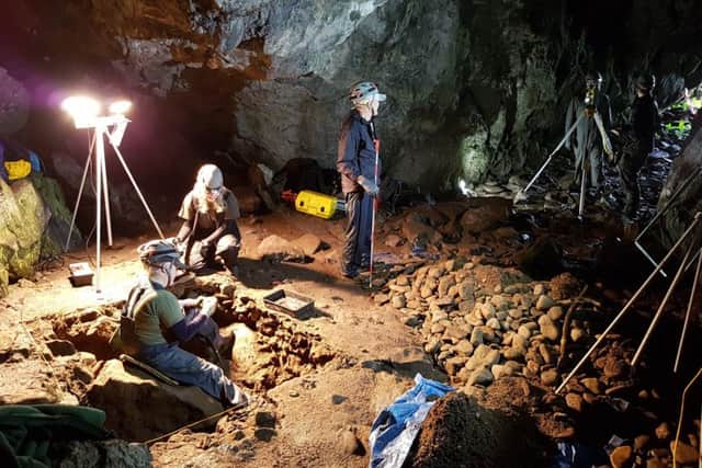 Volunteers at work in the Culzean caves, part of which were occupied during the Iron Age. PIC: NTS.