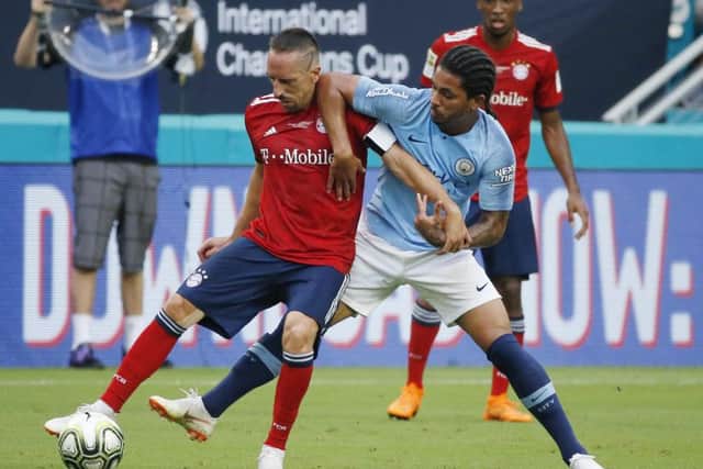 Douglas Luiz fights for possession with Bayern Munich's Franck Ribery during a International Champions Cup friendly match earlier this year. Picture: Getty