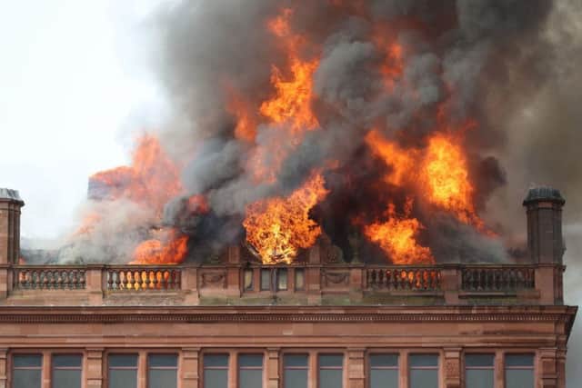 Flames and smoke from a major blaze which has broken out at the Primark store in Belfast city centre. Picture: PA Wire