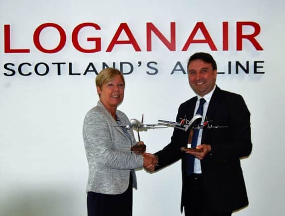 Loganair commercial director Kay Ryan with Turkish Airlines Scotland general manager Gokhan Haciibrahimoglu. Picture: Contributed