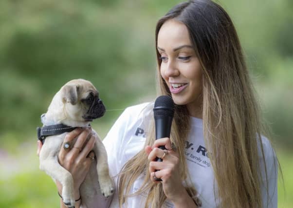 Singer Emiah with pug Bella (15 weeks) . Picture: Peter Devlin