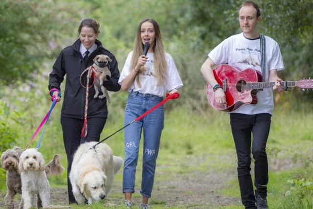 Scottish SPCA Officer Milly Mendes Ferriera,  singer  Emiah and guitarist Stuart McInnes  with pug Bella (15 weeks) , cockapoos Olly and Milly and Golden Retriever Harley. Picture: Scottish SPCA/ Peter Devlin